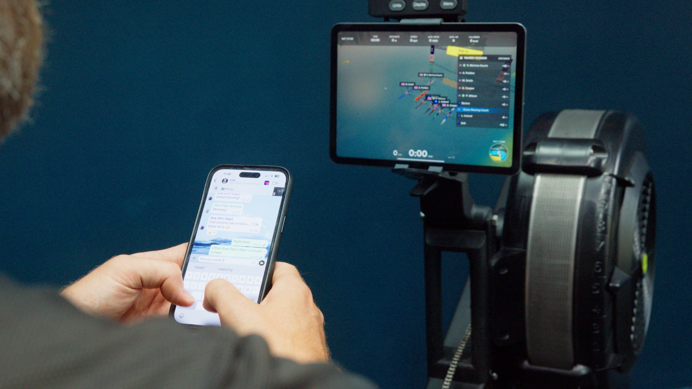 A rower messaging the crew as a live CrewRoom session starts on the tablet