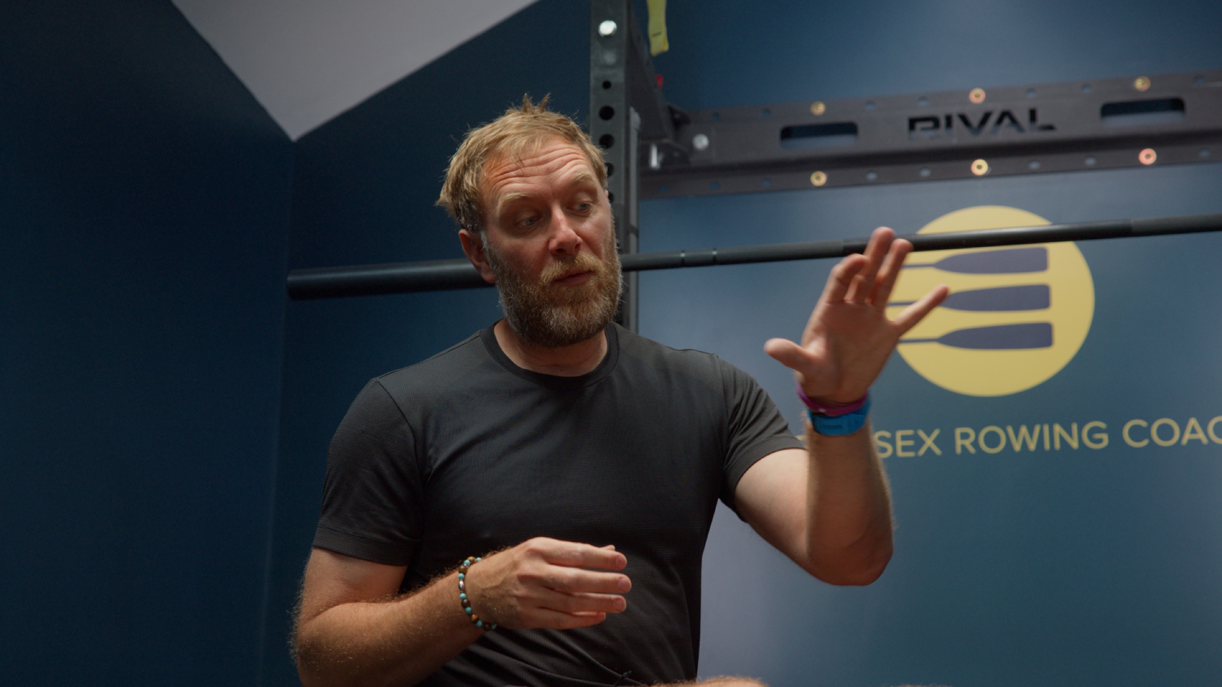 Rob talking a rower through a technical point on a live online session